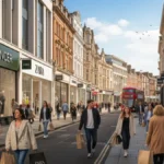 Popular clothing brands UK shoppers walking past Marks & Spencer, Zara and Next stores