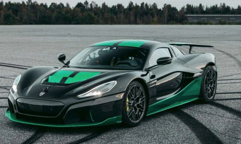 A sleek black and green sports car parked on an empty asphalt lot with skid marks-fastest supercars 2025