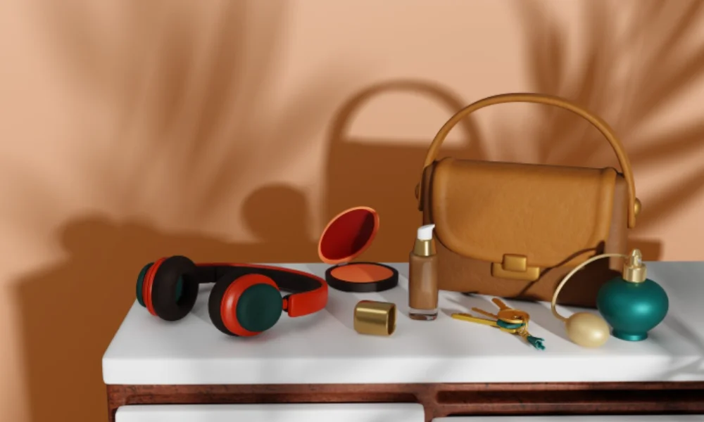 On a white table, there are brown headphones, makeup items, a perfume bottle