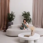 A cozy minimalist living room with neutral tones