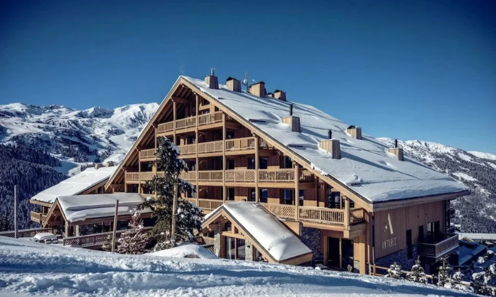 Large wooden chalet in snowy mountains