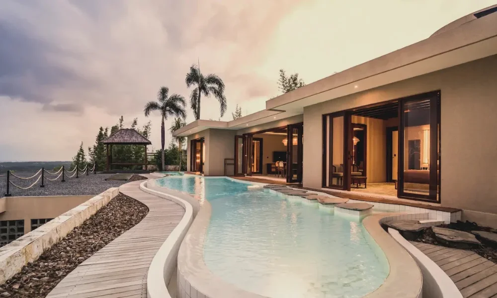 Modern villa with curved pool and mountain view