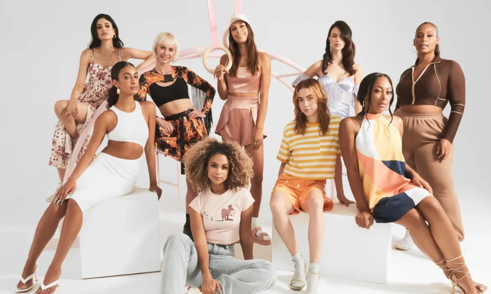 Nine diverse women pose in stylish outfits