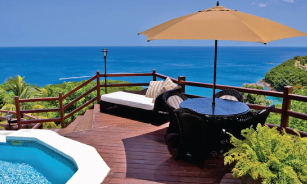 Ocean view deck with pool, lounge, table, umbrella