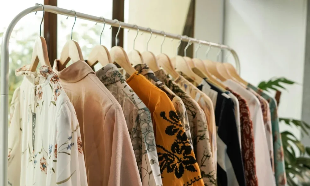 Rack of colorful patterned shirts on hangers