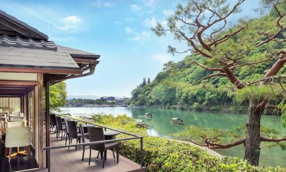 restaurant balcony overlooking river with boats