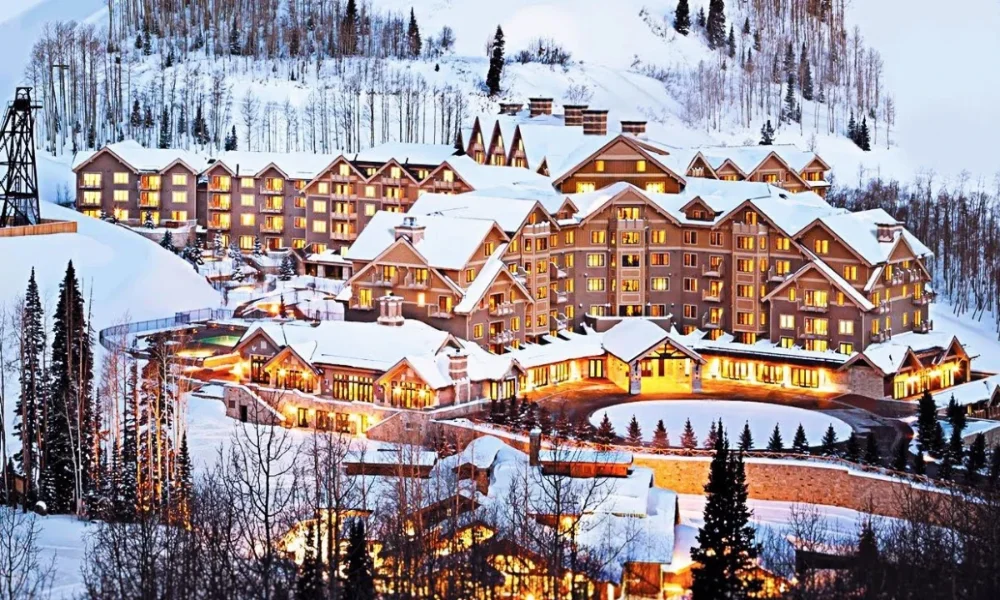 Snow-covered ski resort buildings at dusk