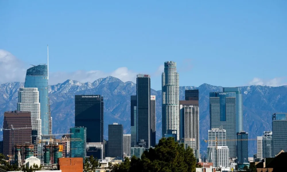 Los Angeles skyline with snowy mountains