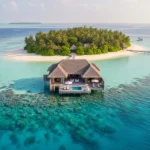 Overwater bungalow, tropical island, coral reef