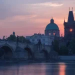 Prague Charles Bridge at sunset, pink sky