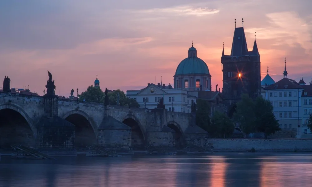 Prague Charles Bridge at sunset, pink sky