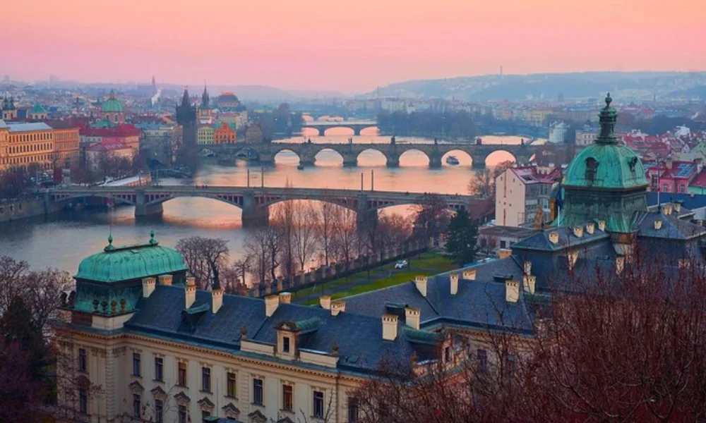 Prague cityscape at sunset with bridges