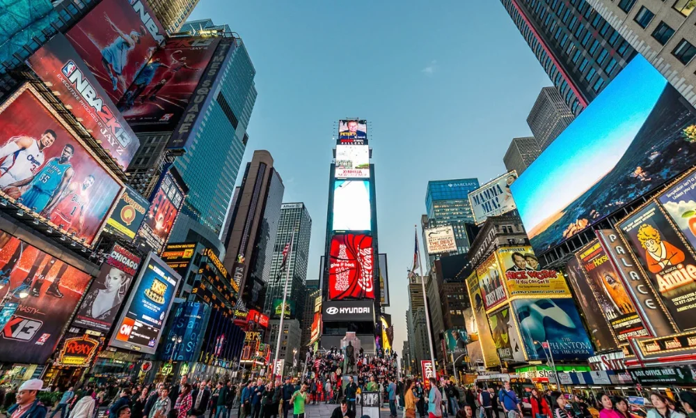 Times Square with bright billboards and crowds