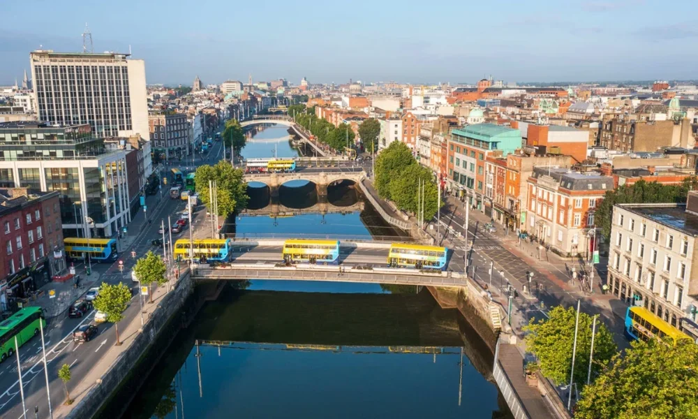 Aerial view of Dublin city with river and buses
