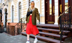 Blonde woman in plaid blazer and red skirt