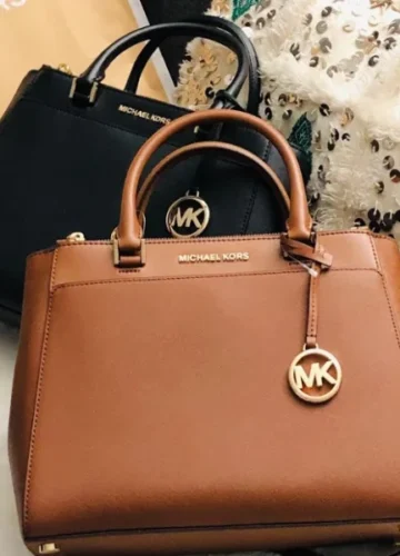 Brown and black Michael Kors handbags