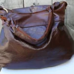 Brown leather handbag with gold hardware