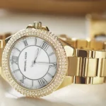 Gold Michael Kors watch with crystal bezel