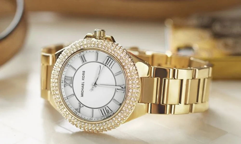 Gold Michael Kors watch with crystal bezel