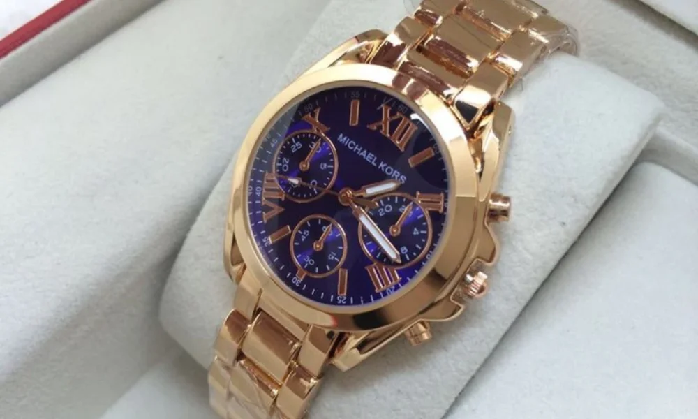 Rose gold Michael Kors watch with blue face