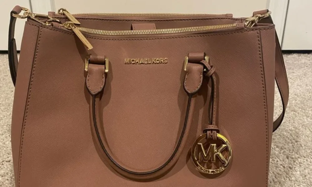 Brown Michael Kors satchel with gold hardware