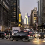 Busy city street with cars and tall buildings