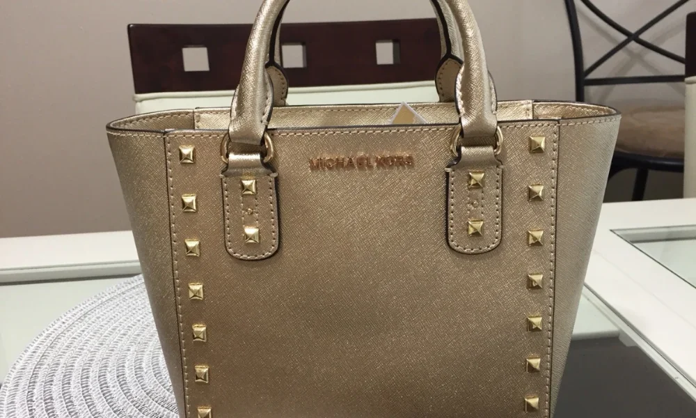 Gold Michael Kors handbag with studs