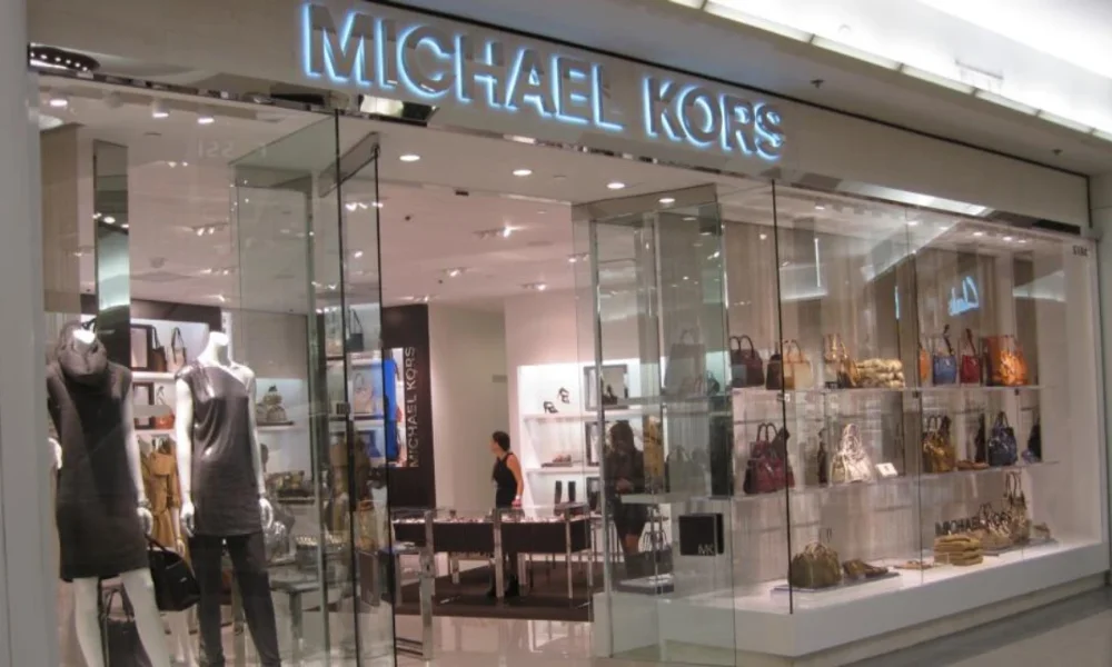Michael Kors store with mannequins and handbags