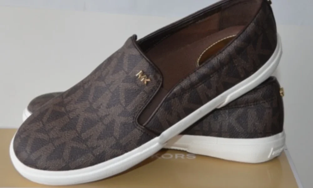 Pair of brown Michael Kors slip-on shoes