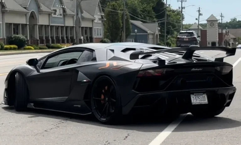 black lamborghini aventador svj on road