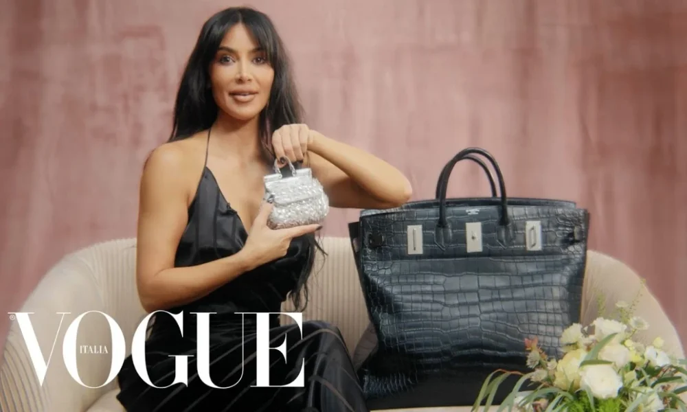 Kim Kardashian holds tiny bag next to large one
