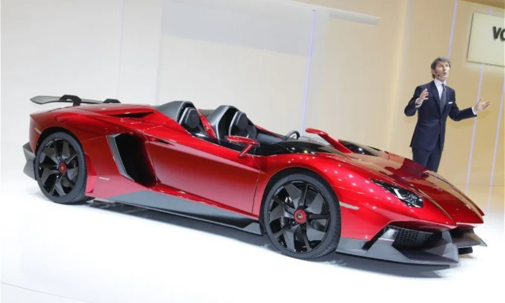 red lamborghini with man in suit gesturing