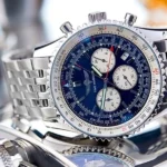Silver watch with blue face, white dials