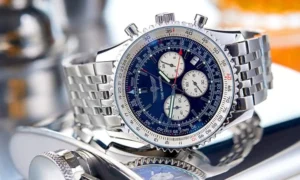 Silver watch with blue face, white dials