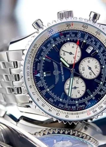 Silver watch with blue face, white dials