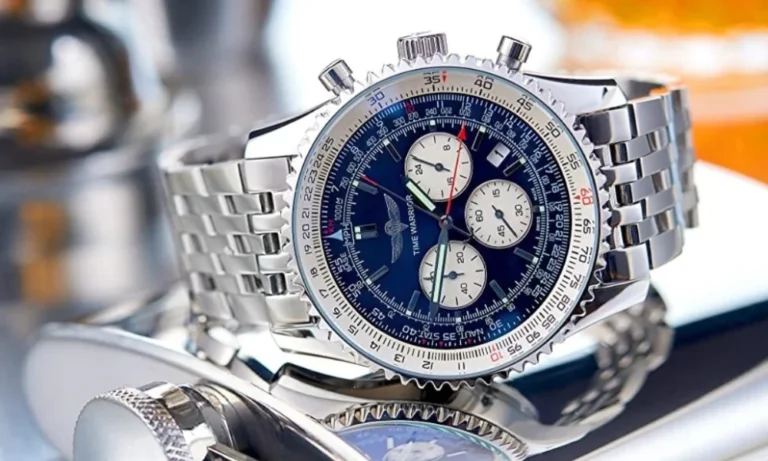 Silver watch with blue face, white dials