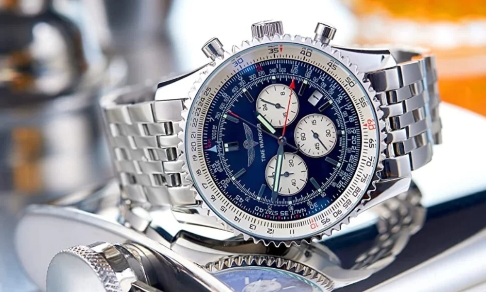 Silver watch with blue face, white dials