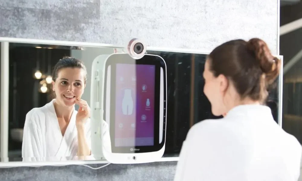 Woman in robe looking at smart mirror