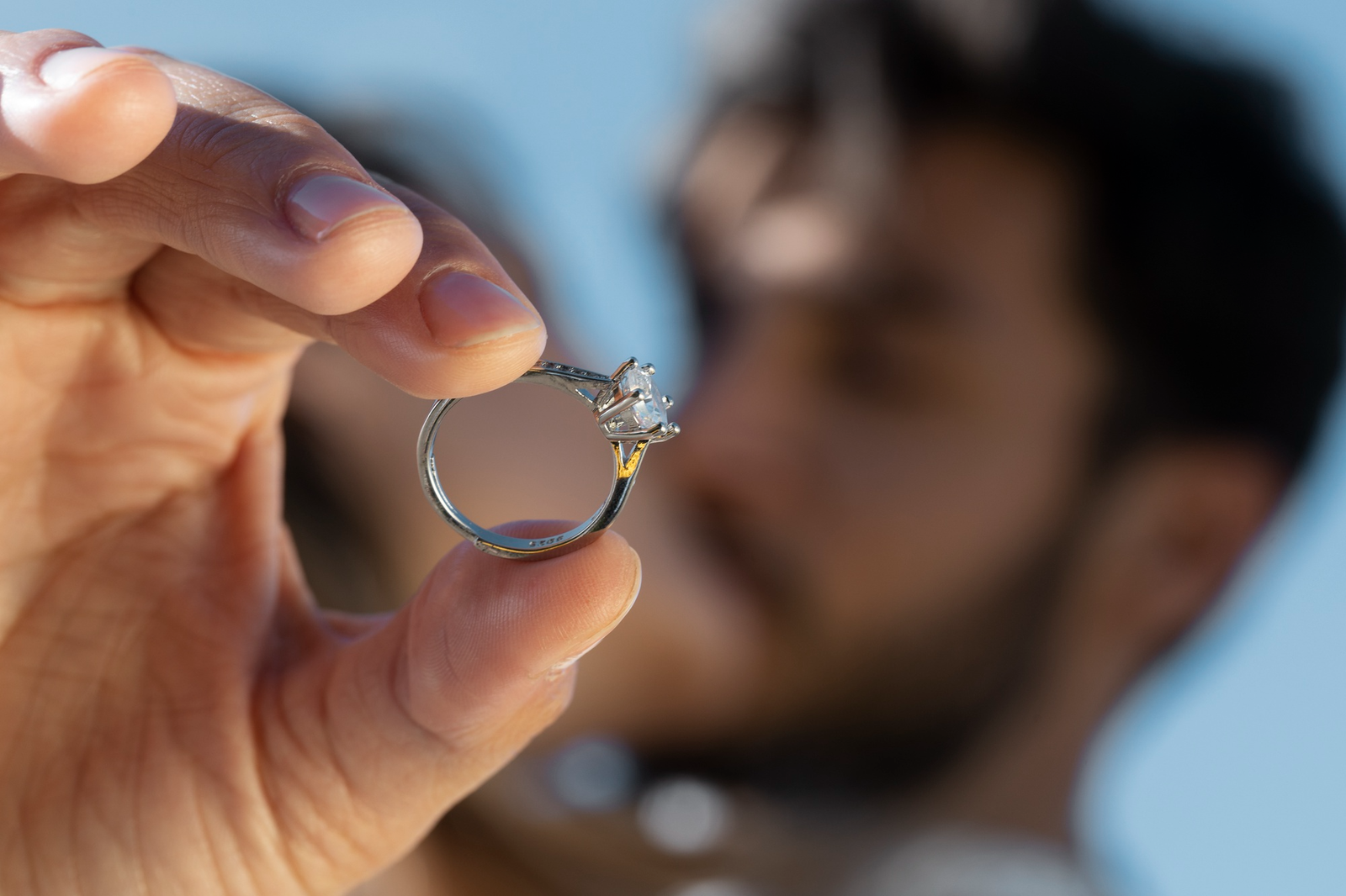 Tiffany and Co engagement rings vs independent luxury jewelers featuring a classic solitaire diamond prong setting inspected up close.
