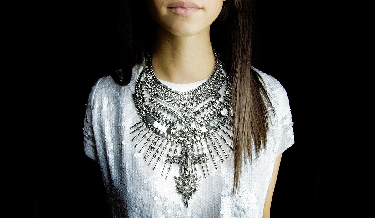 Close up of a bold silver statement necklace