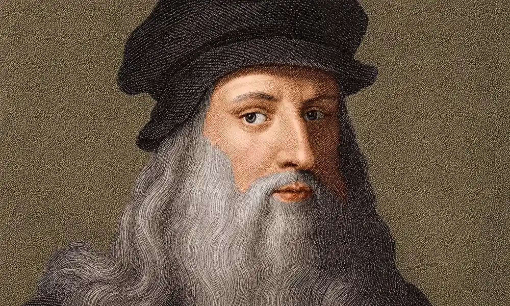 Portrait of Renaissance painter Leonardo da Vinci with a long gray beard and dark cap