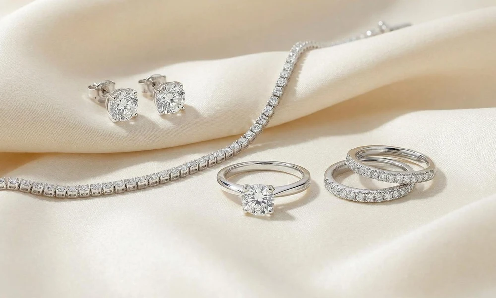 White gold solitaire ring, tennis bracelet, studs, and stacking bands.