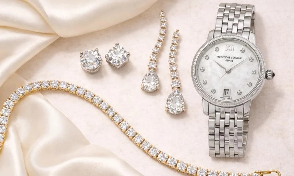 Luxury diamond watch displayed alongside diamond earrings and a tennis bracelet.