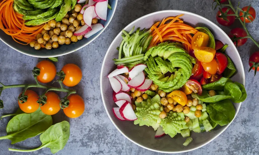 Two bowls of fresh vegetable salad-Best Vegan Cookbooks