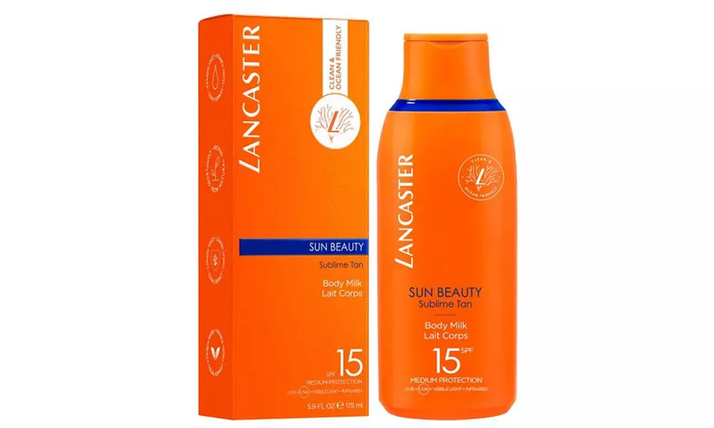 Bright orange Lancaster Sun Beauty Body Milk SPF 15 bottle beside its matching box-best skincare products for dry skin