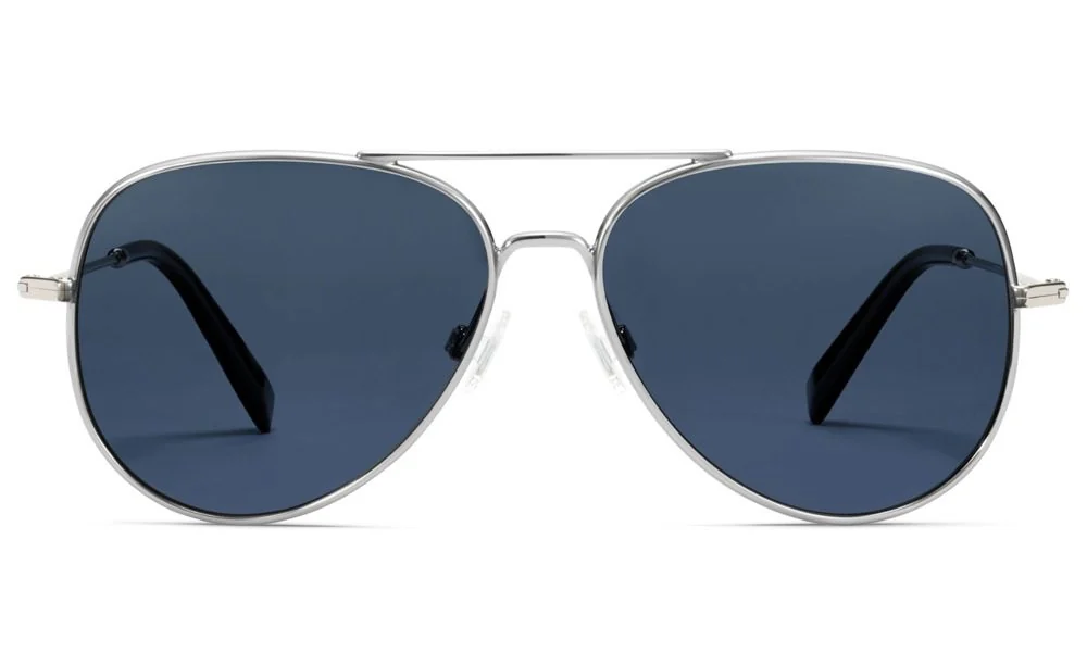Silver aviator sunglasses with dark blue lenses and black temple arms, shown front-facing on a white background; sleek, classic style.