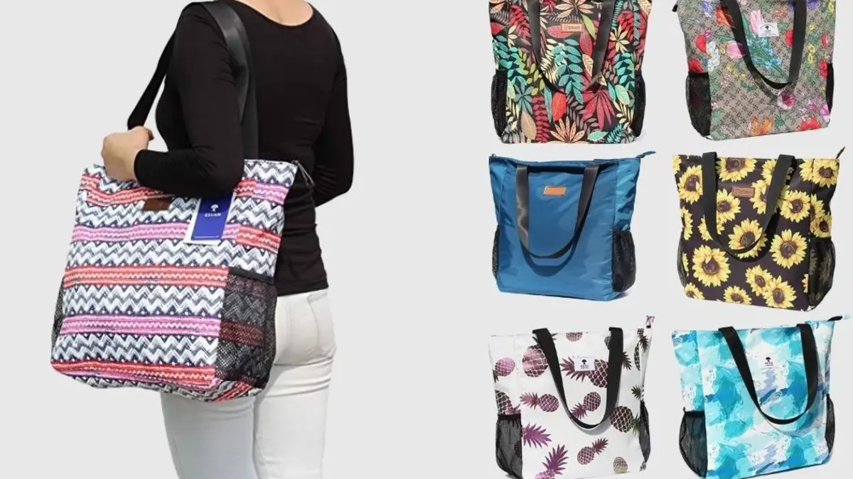 A woman carries a large patterned shoulder tote, alongside six colorful tote bags with floral, geometric, and abstract prints, shown on a light background.