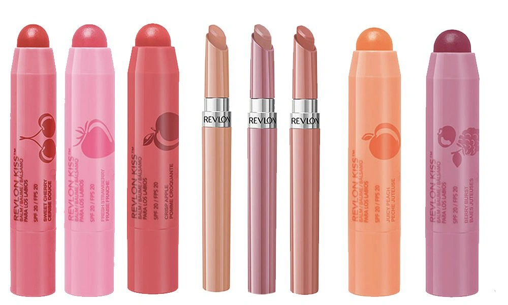 Seven Revlon makeup sticks in pink, coral, nude, and mauve shades stand upright against a white background, showcasing colorful lip and cheek products.