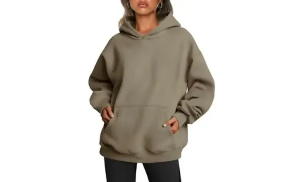 A model wears an oversized taupe hoodie with a kangaroo pocket and black pants-How Premium Bear Skin Hoodie is Made