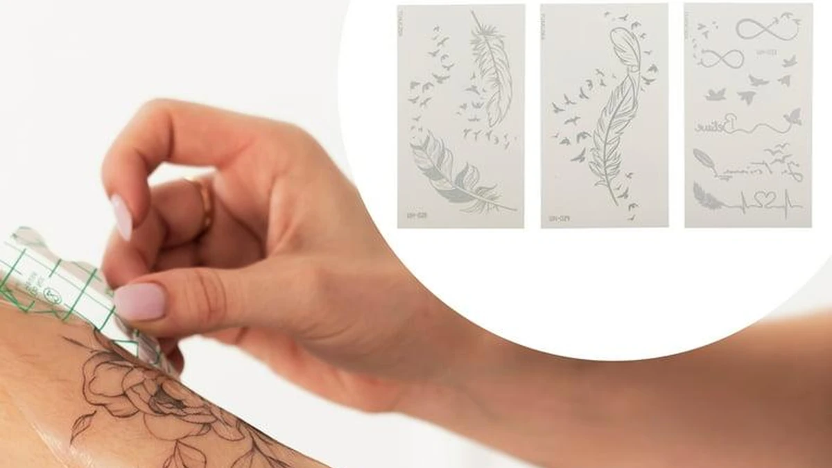 Applying temporary tattoo decal to arm with sheet designs.